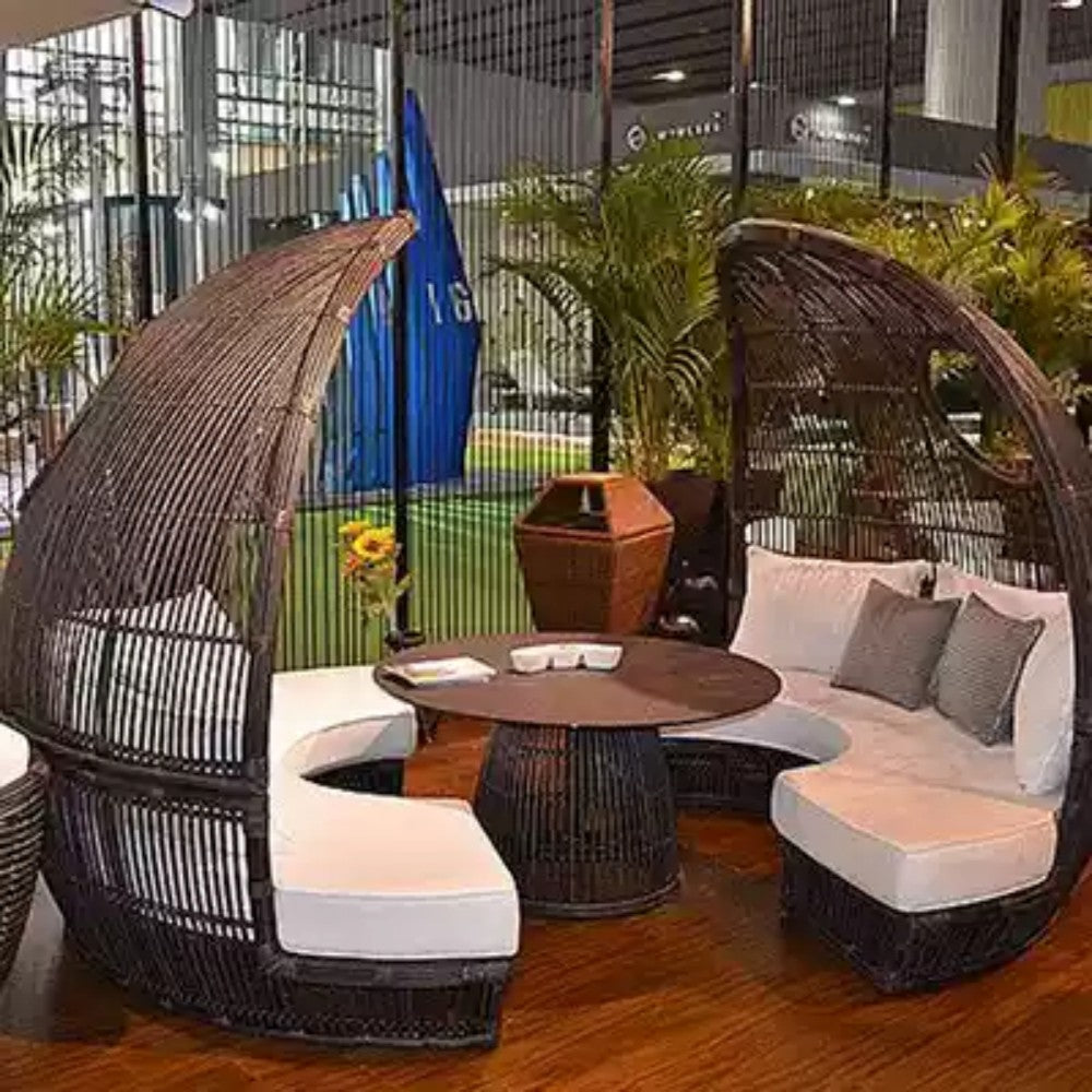 Modern Egg-Shaped Outdoor Seating Set with Brown Cushions and Table